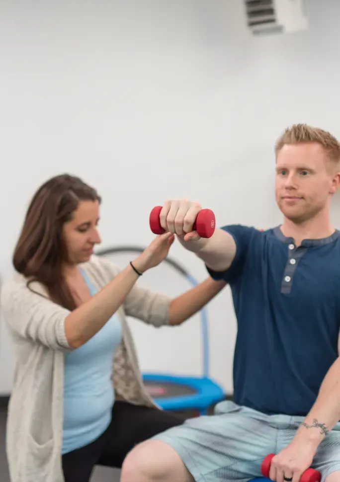 Doctor of Physical Therapy working one on one with a patient
